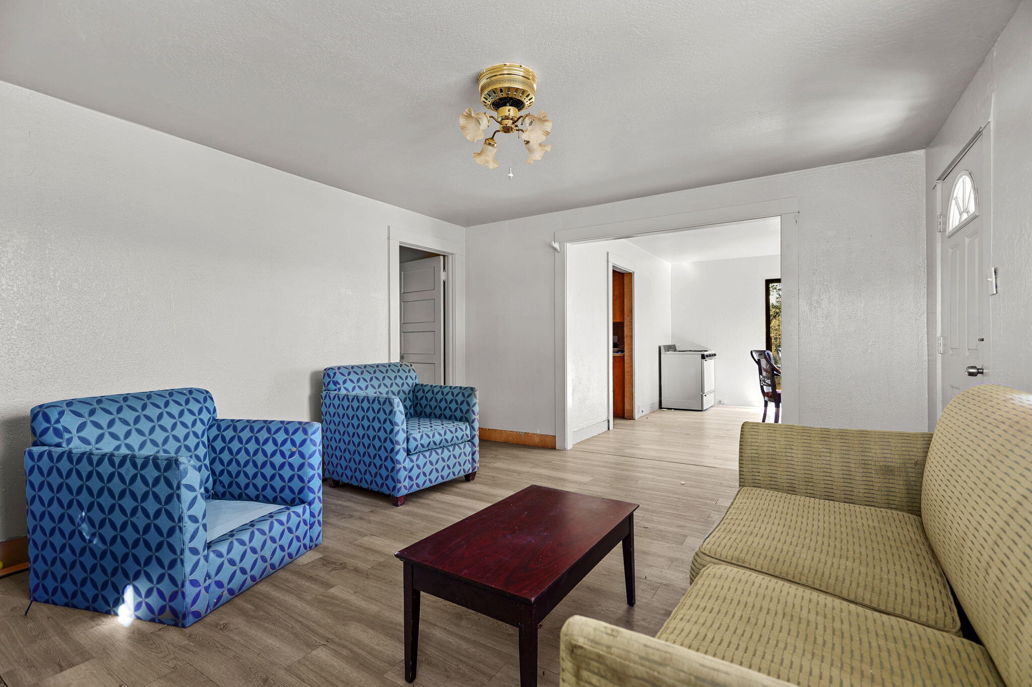 15015 Highway 36, Unit WEST Red Bluff, CA 96080 - Photo 23 of 51 a living room with furniture and a chandelier