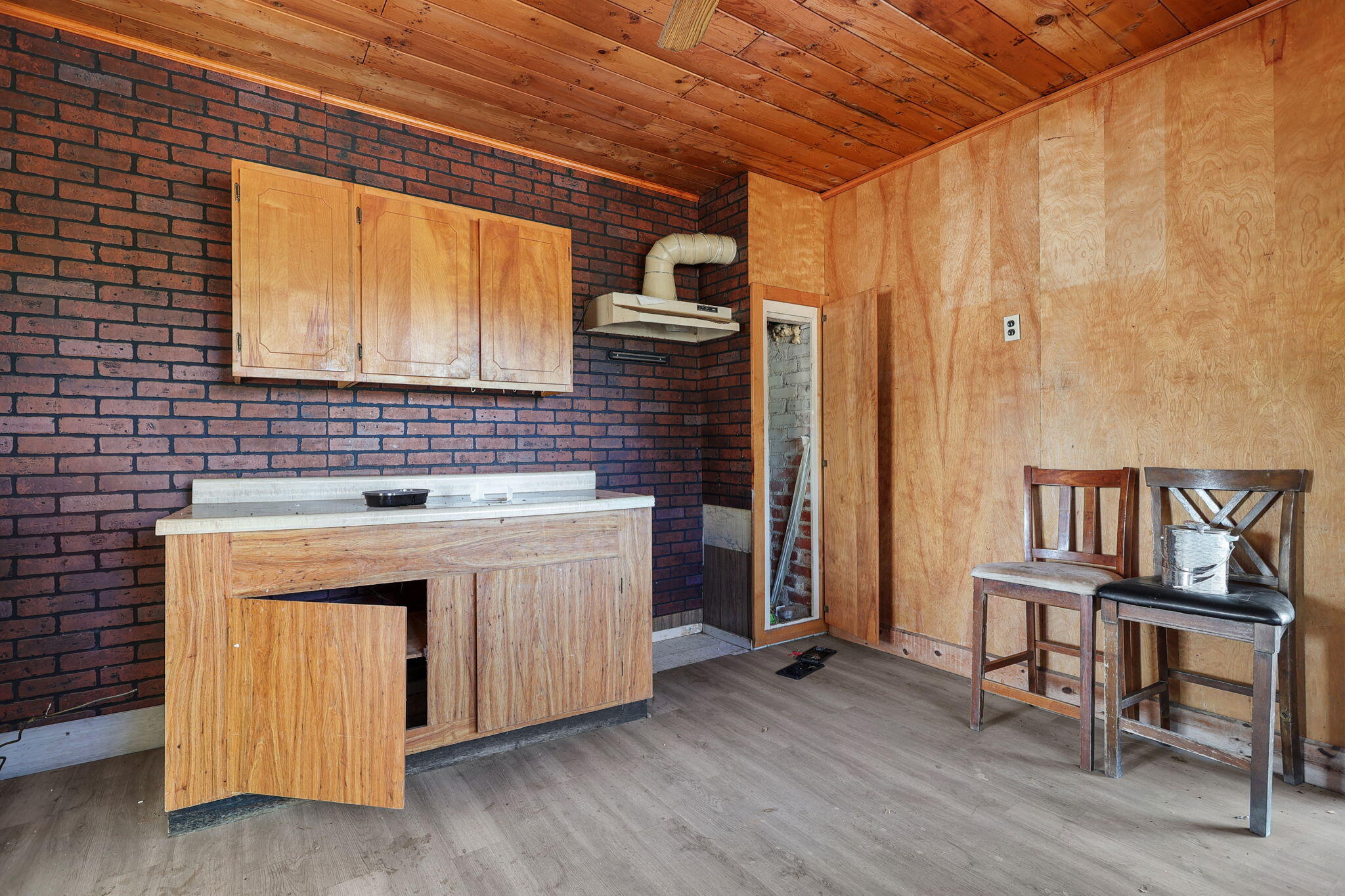 15015 Highway 36, Unit WEST Red Bluff, CA 96080 - Photo 25 of 51 a kitchen with granite countertop a stove and a wooden floors