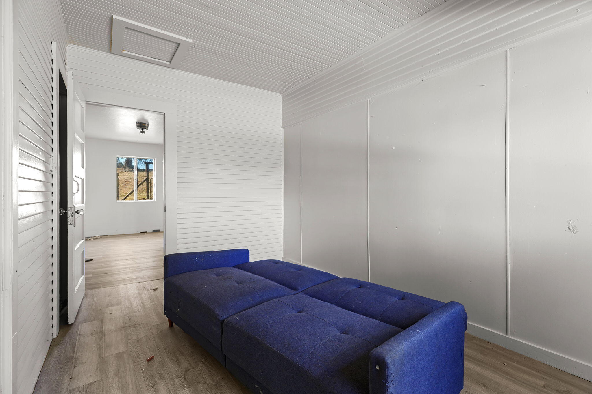 15015 Highway 36, Unit WEST Red Bluff, CA 96080 - Photo 27 of 51 a living room with furniture and wooden floor