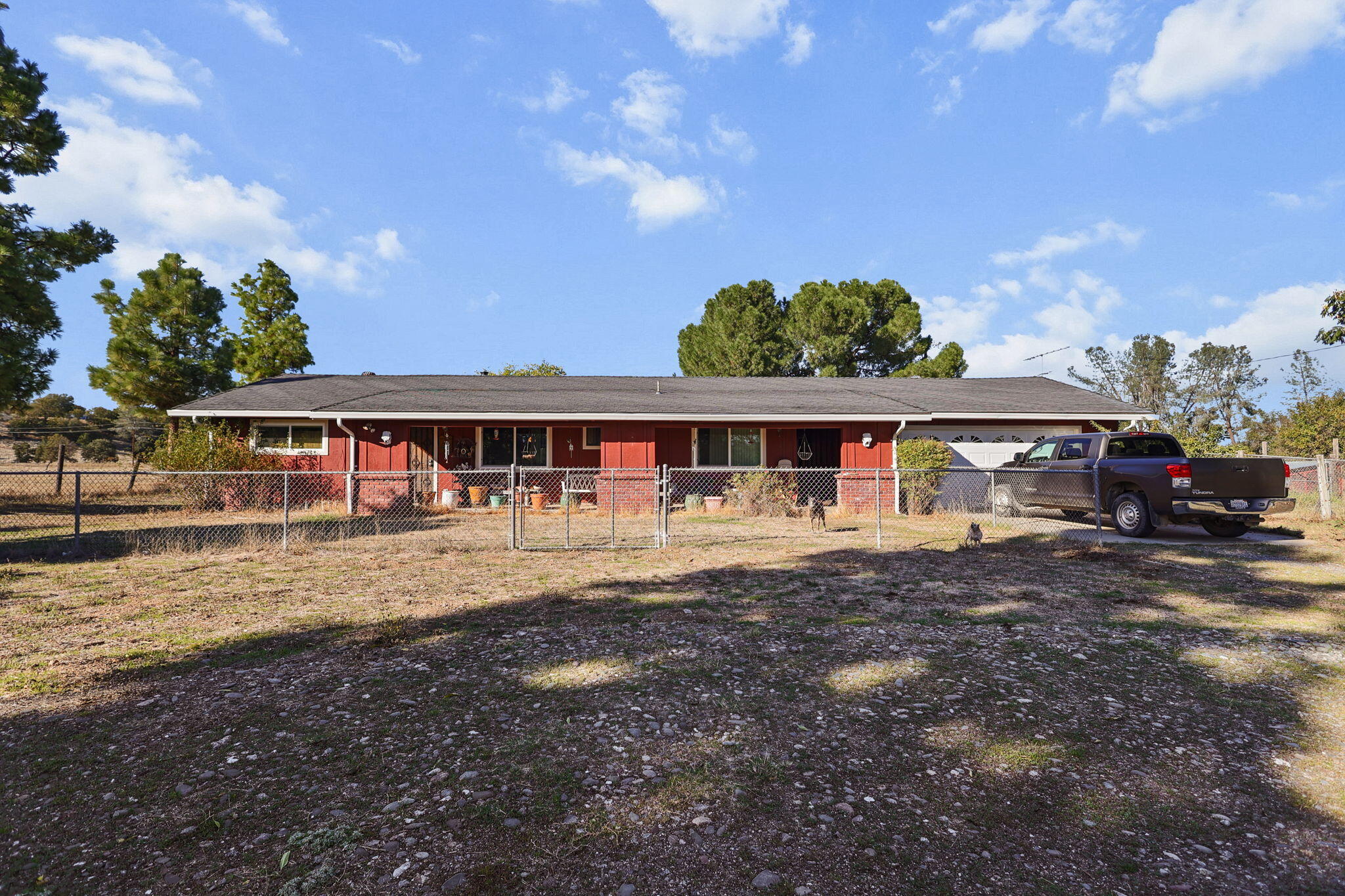 15015 Highway 36, Unit WEST Red Bluff, CA 96080 - Photo 43 of 51 a front view of a house with a yard