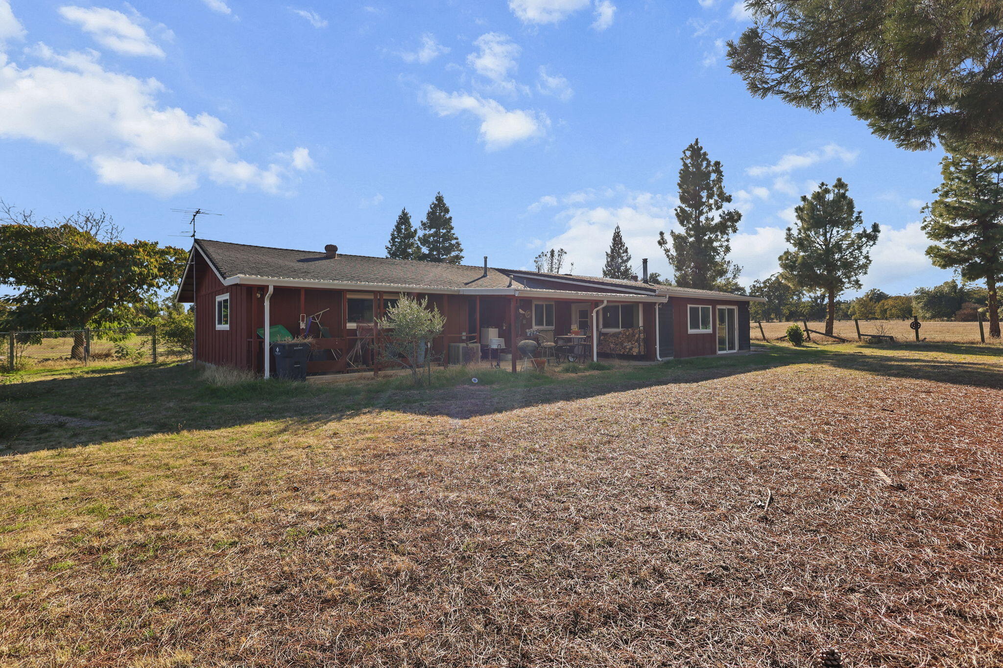 15015 Highway 36, Unit WEST Red Bluff, CA 96080 - Photo 45 of 51 a front view of a house with a yard