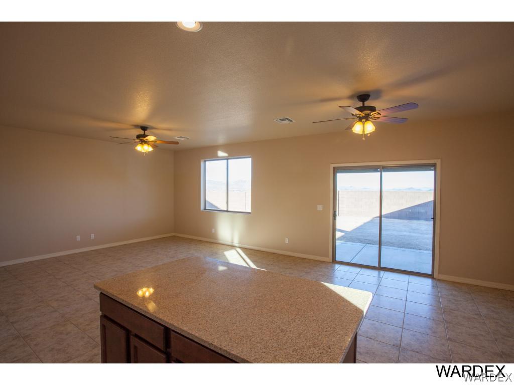 4830 North Neal Ranch Road Kingman, AZ 86401 - Photo 6 of 13 a view of an empty room with a window