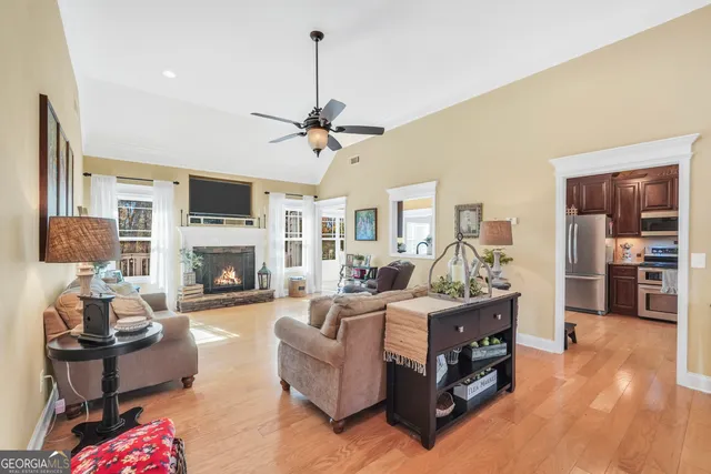 a living room with furniture fireplace and a flat screen tv