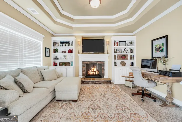 a living room with furniture window and a fireplace