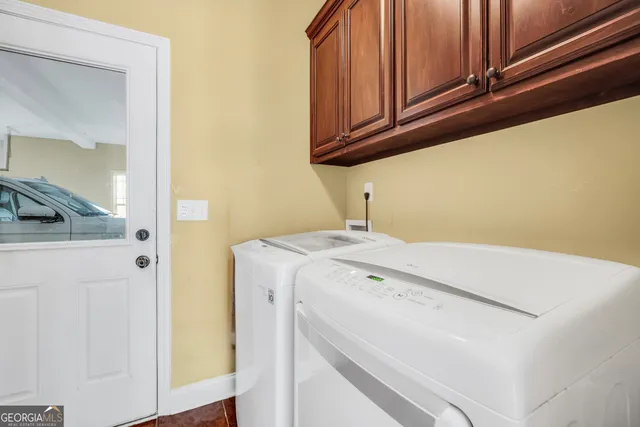 a utility room with dryer and washer
