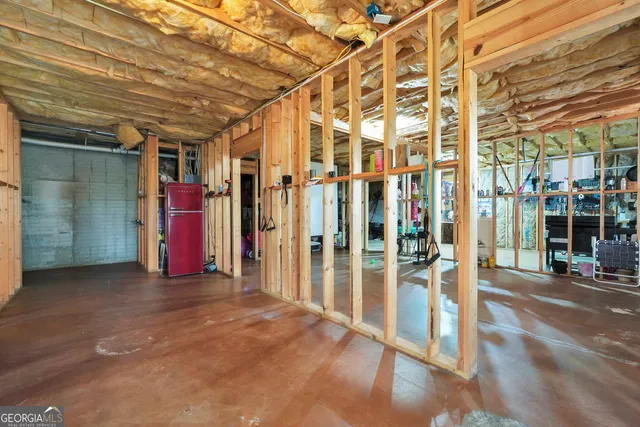 a view of a room with wooden walls