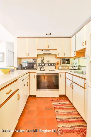 a view of a kitchen with a sink and cabinets