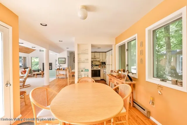 a very nice looking living room with a large window and furniture