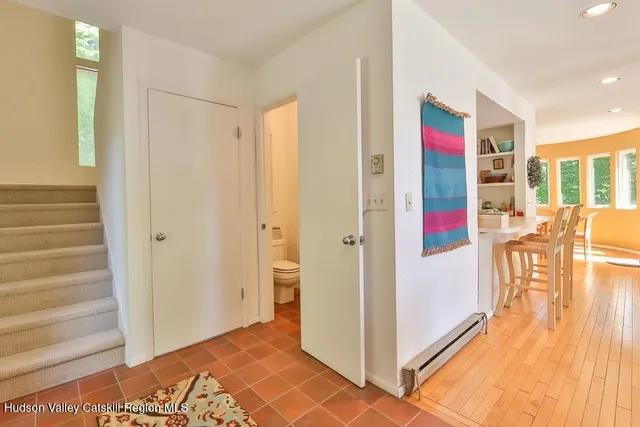 a view of an entryway with wooden floor