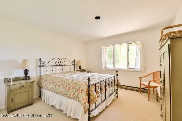 a bedroom with a bed and a table in it