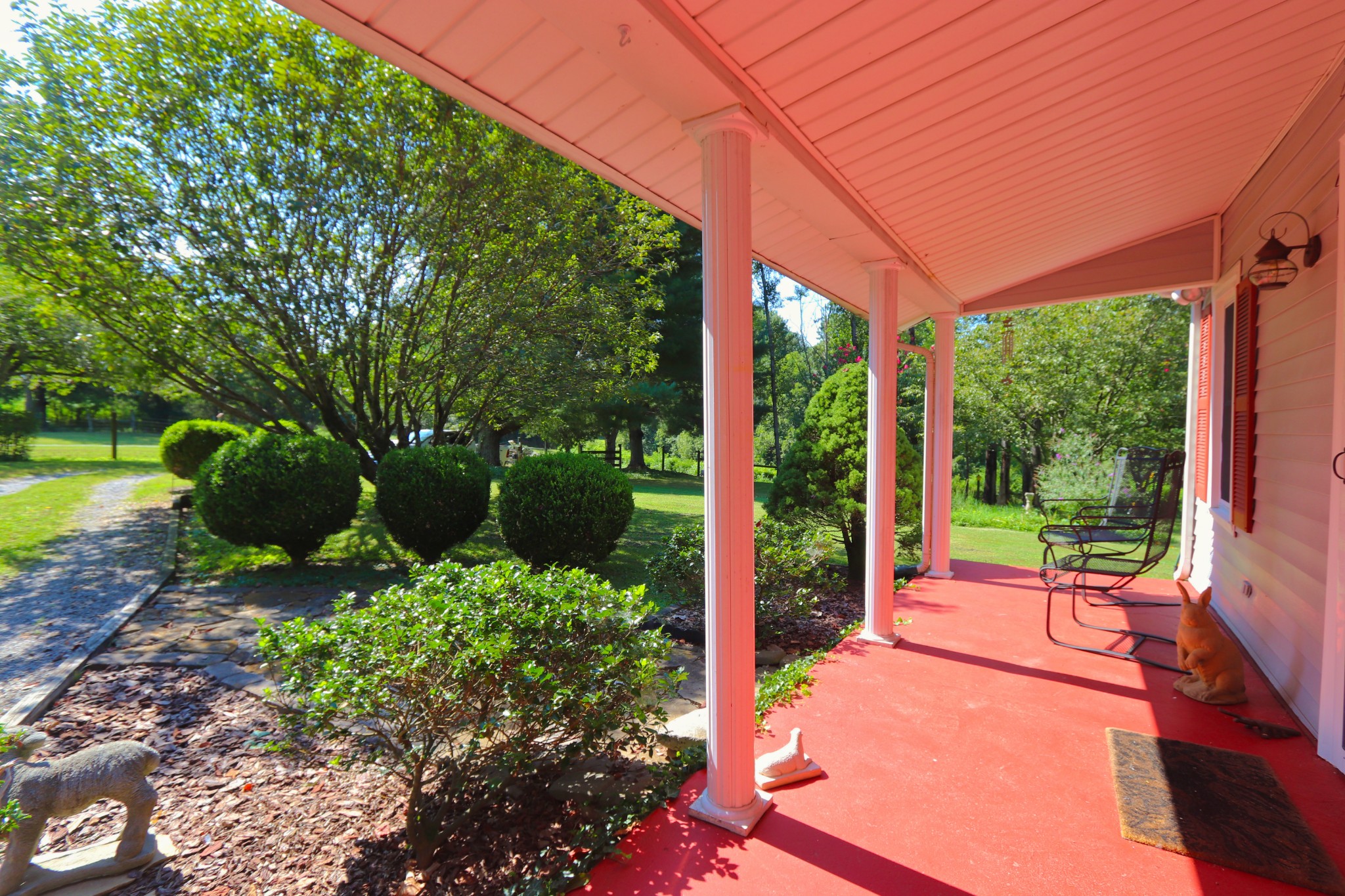 6930 Beasleys Bend Road Lebanon, TN 37087 - Photo 3 of 26 a view of a patio with a table chairs and a backyard