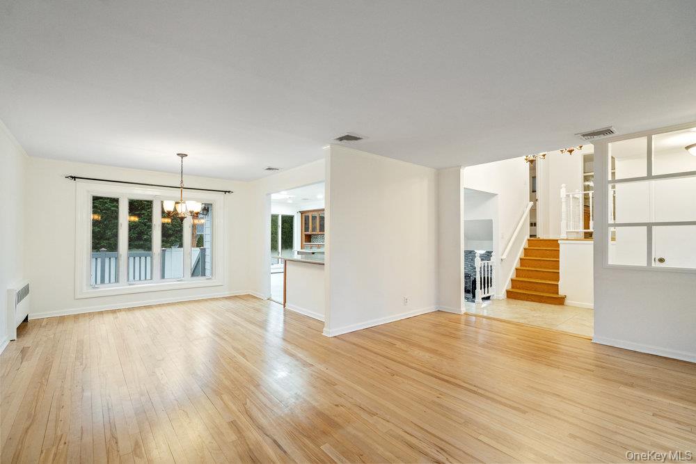 15 Morris Drive Syosset, NY 11791 - Photo 14 of 32 a view of an empty room with wooden floor and a window