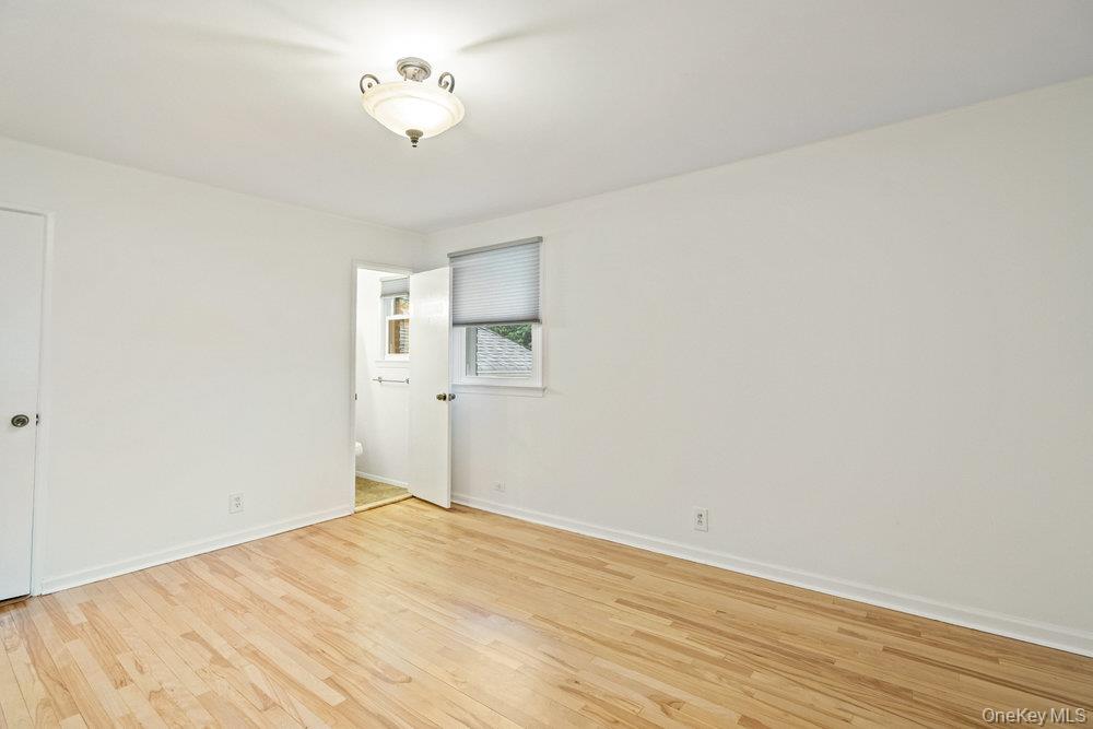 15 Morris Drive Syosset, NY 11791 - Photo 21 of 32 a view of empty room with wooden floor