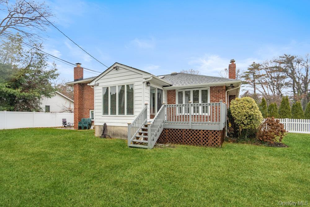 15 Morris Drive Syosset, NY 11791 - Photo 31 of 32 a front view of a house with garden