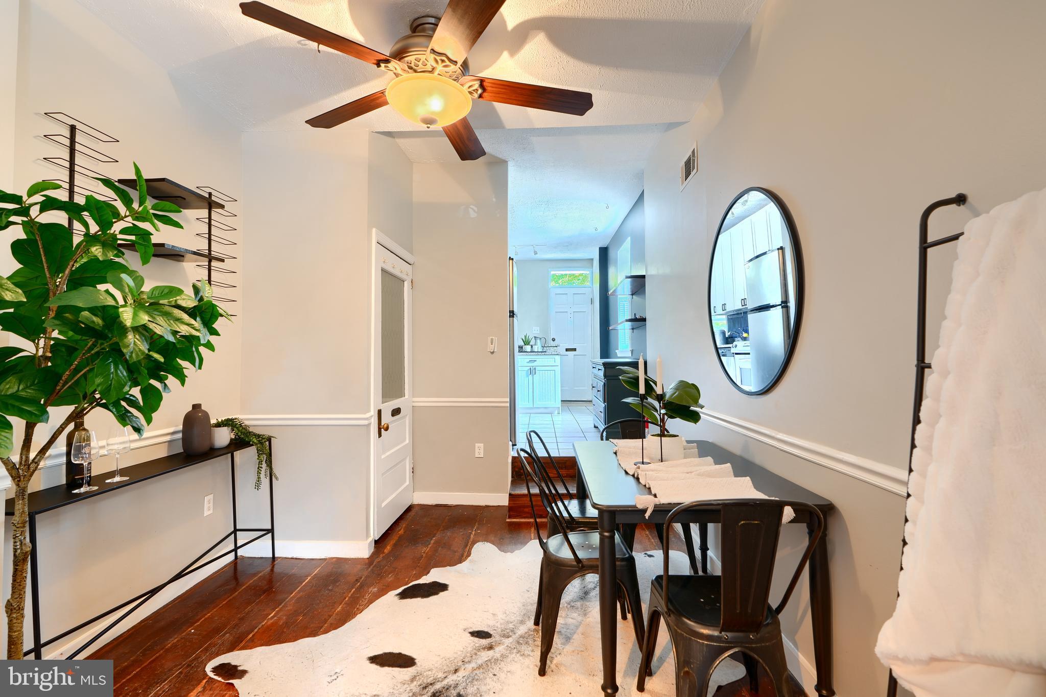 1142 Riverside Avenue Baltimore, MD 21230 - Photo 11 of 41 a view of a dining room with furniture and a potted plant