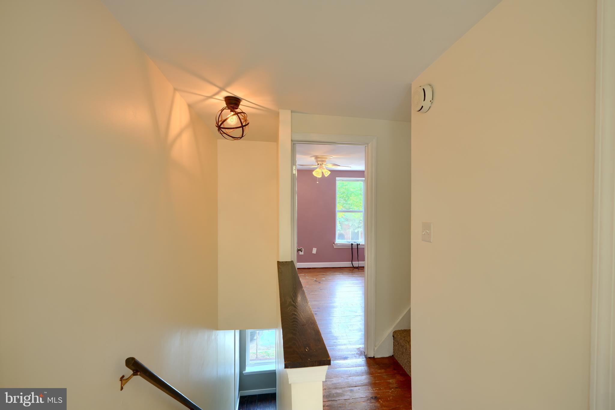 1142 Riverside Avenue Baltimore, MD 21230 - Photo 25 of 41 a view of hallway with wooden floor