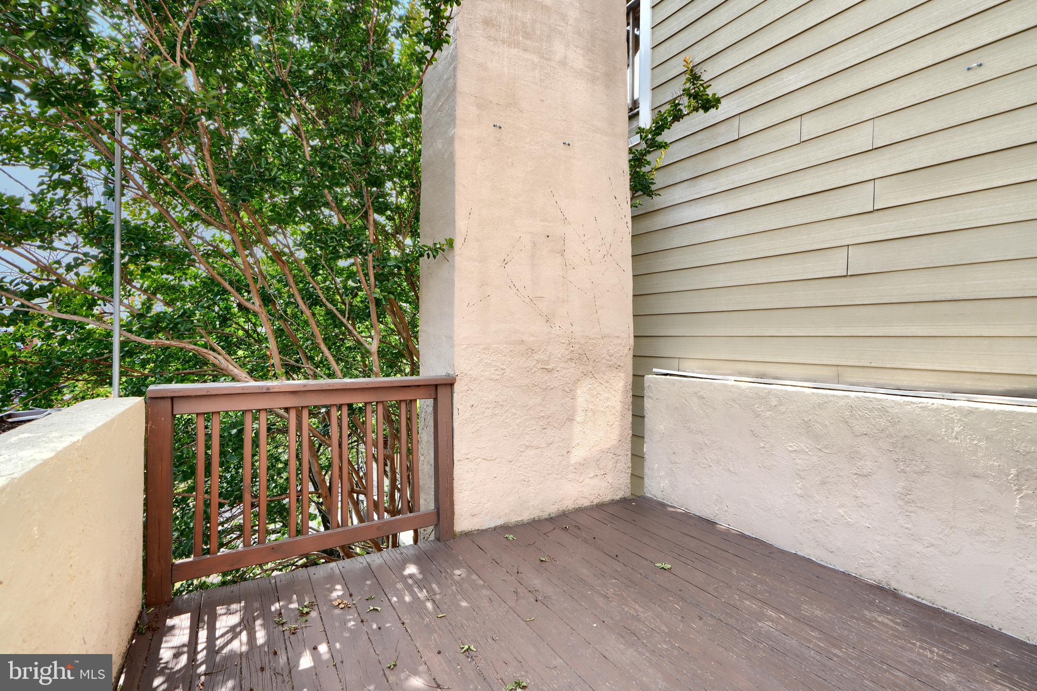 1142 Riverside Avenue Baltimore, MD 21230 - Photo 30 of 41 a view of balcony with wooden floor and fence