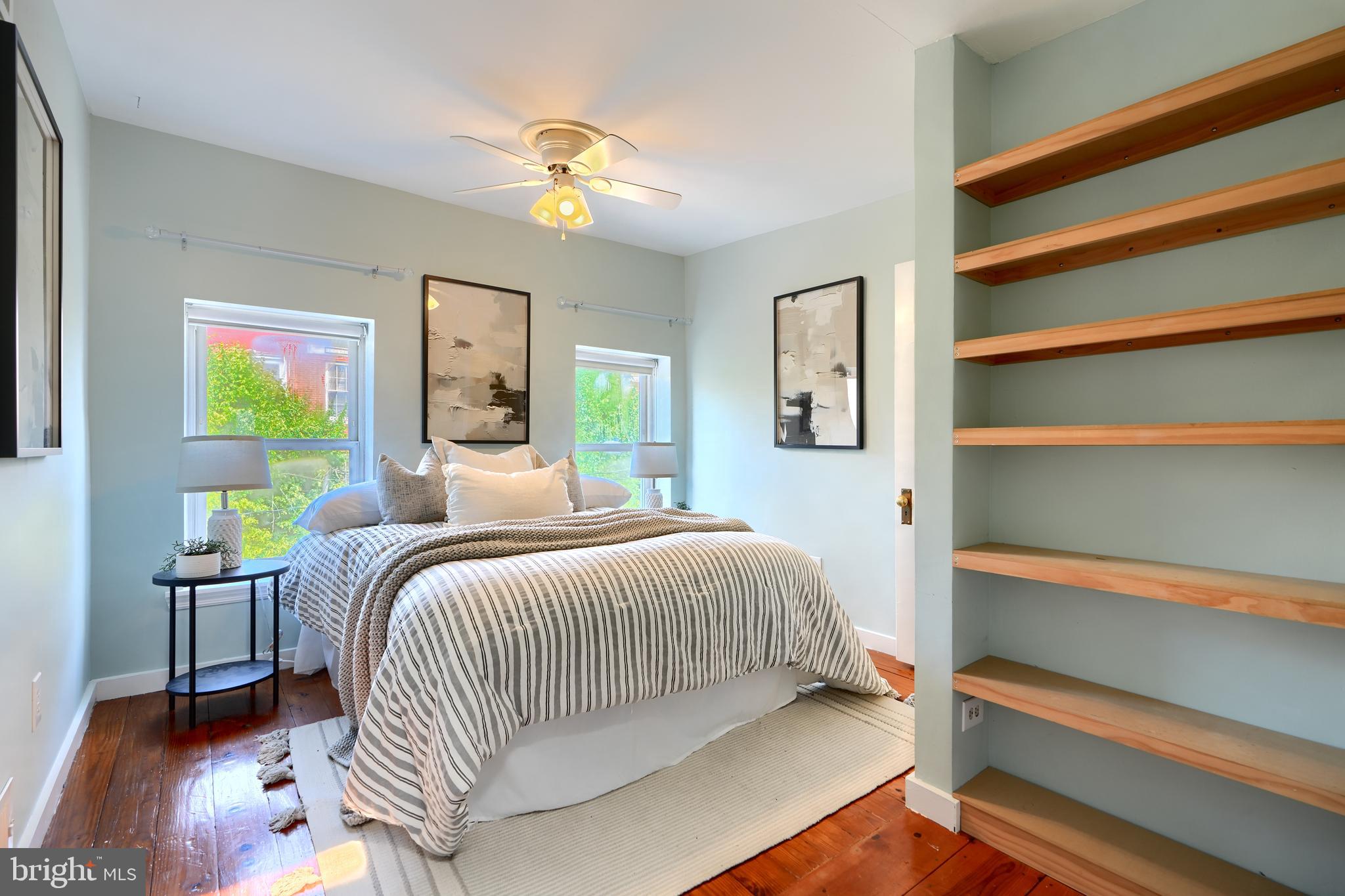 1142 Riverside Avenue Baltimore, MD 21230 - Photo 33 of 41 a bedroom with a bed and a chandelier