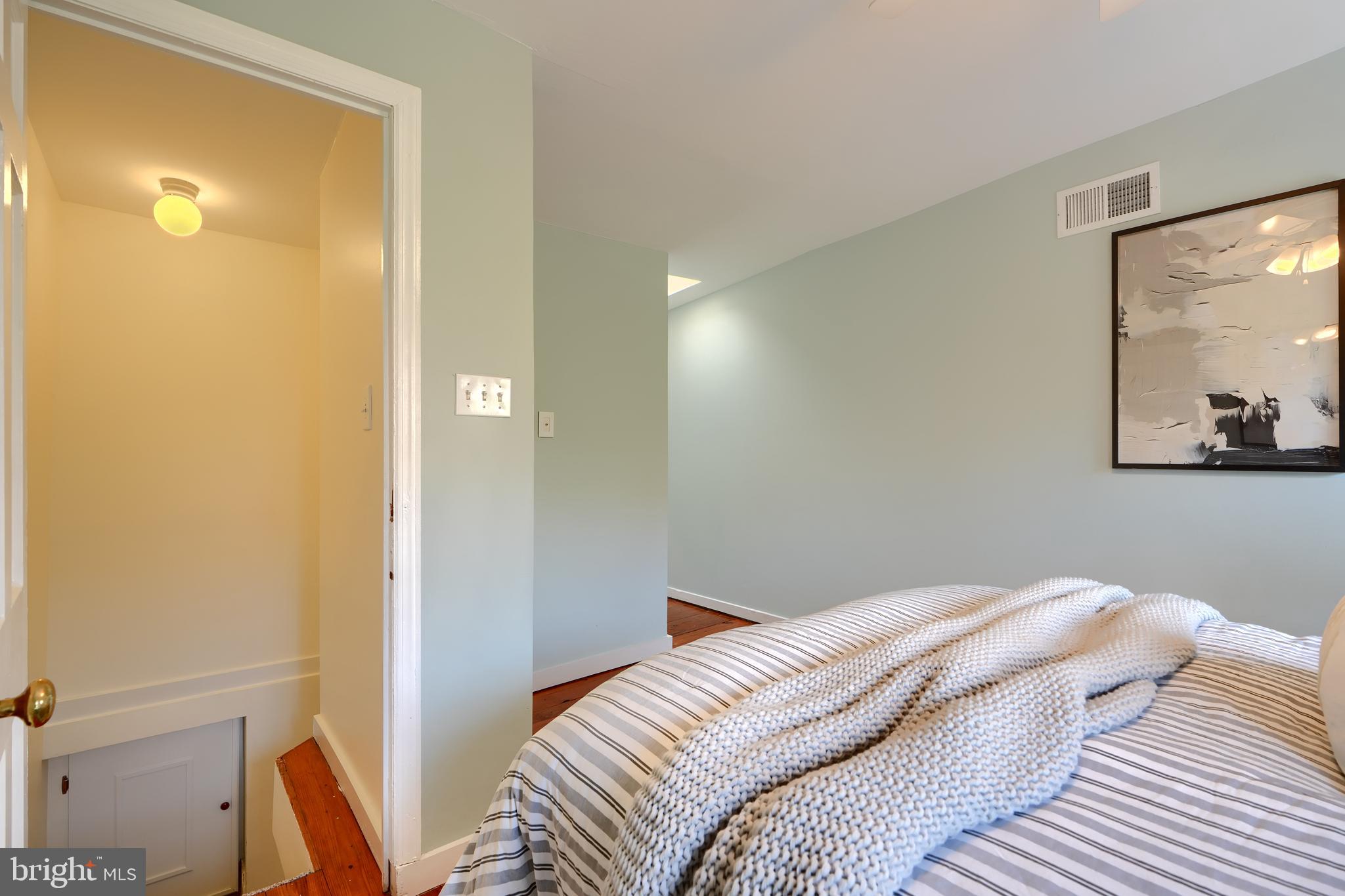 1142 Riverside Avenue Baltimore, MD 21230 - Photo 35 of 41 a bedroom with a bed and a mirror