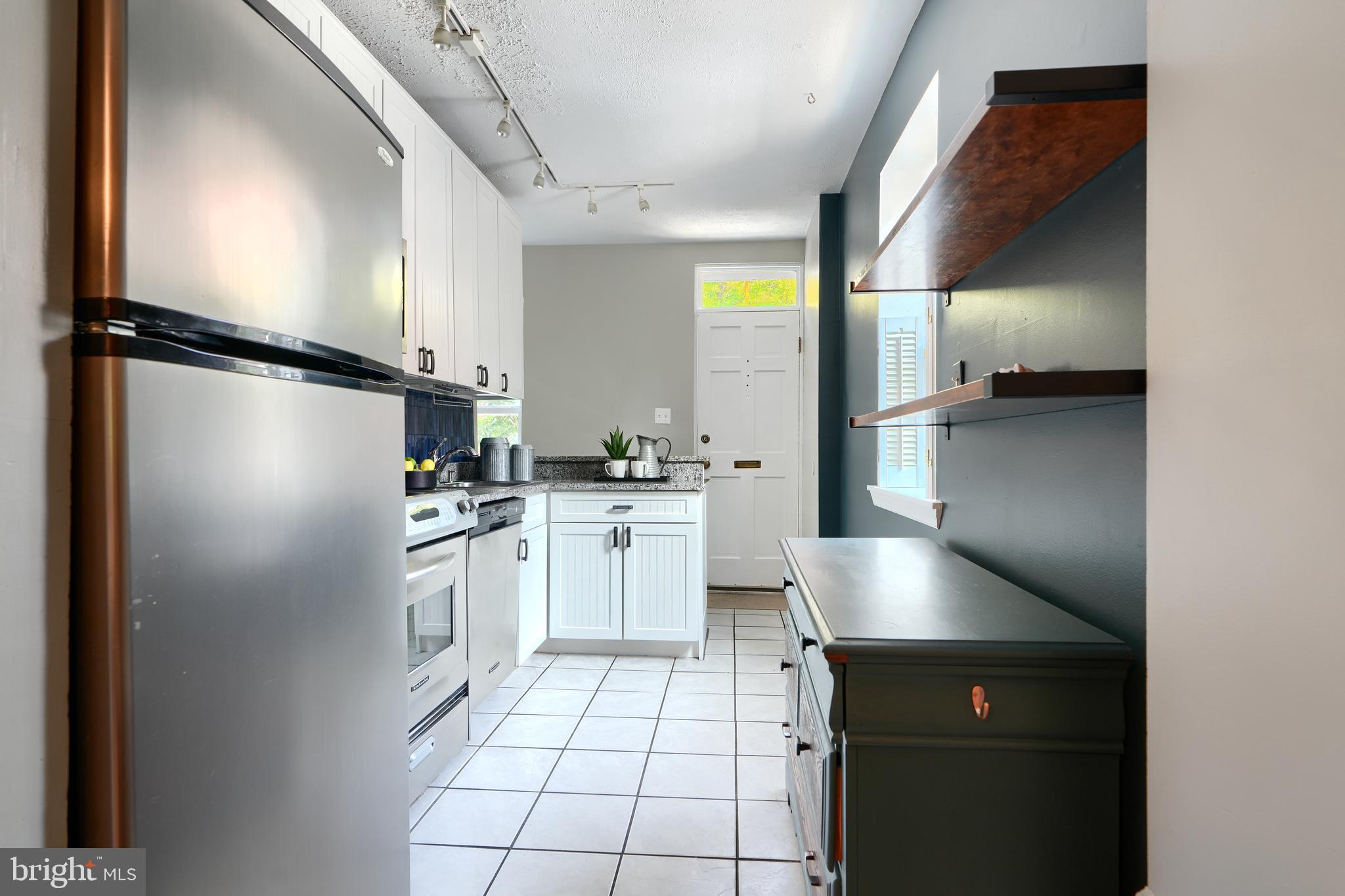 1142 Riverside Avenue Baltimore, MD 21230 - Photo 8 of 41 a kitchen with a refrigerator and a sink