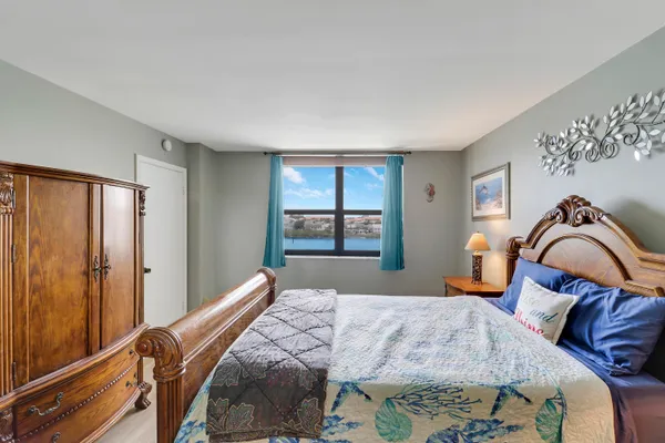 a bedroom with a bed and window
