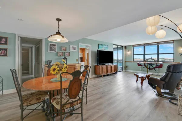 a view of a livingroom with furniture window and wooden floor