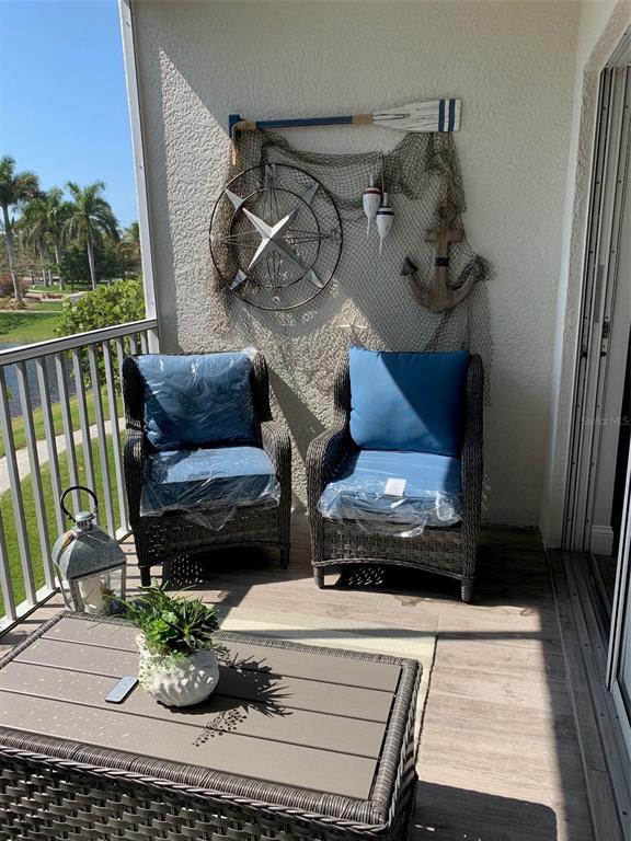 8411 Placida Road, Unit 205 Placida, FL 33946 - Photo 16 of 51 a living room with furniture and a fireplace