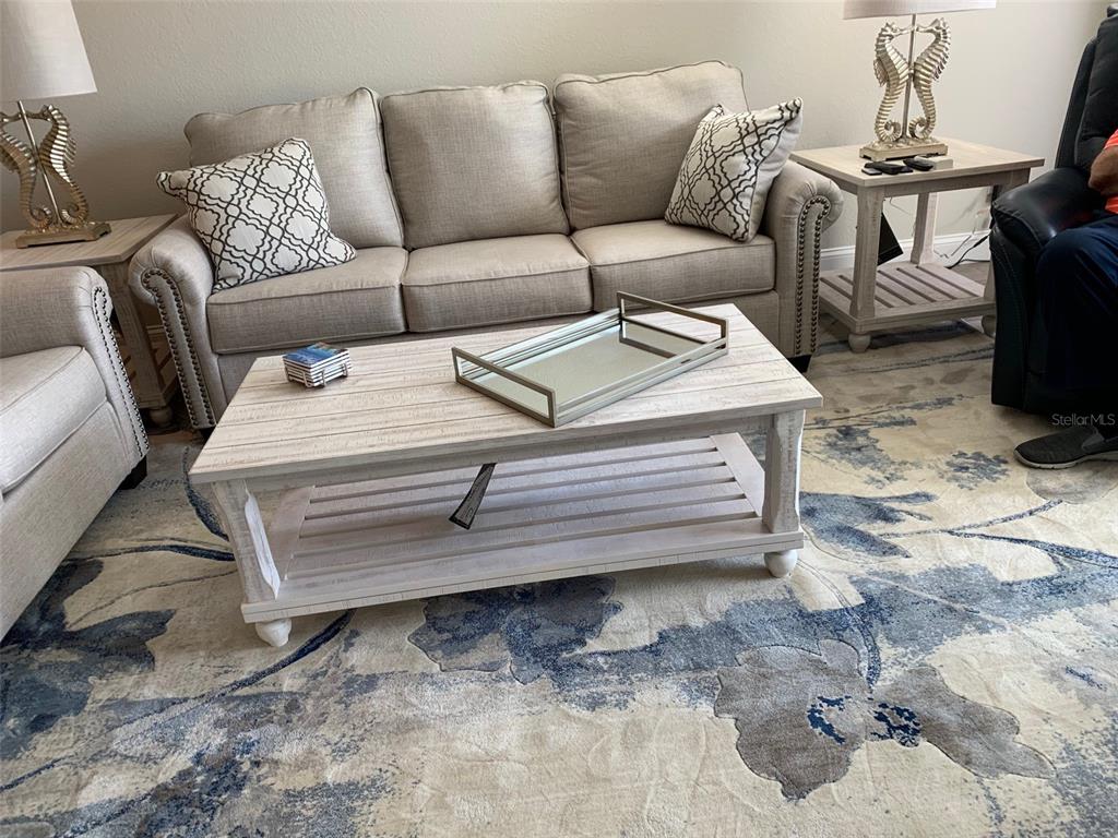 8411 Placida Road, Unit 205 Placida, FL 33946 - Photo 18 of 51 a living room with furniture and a couch