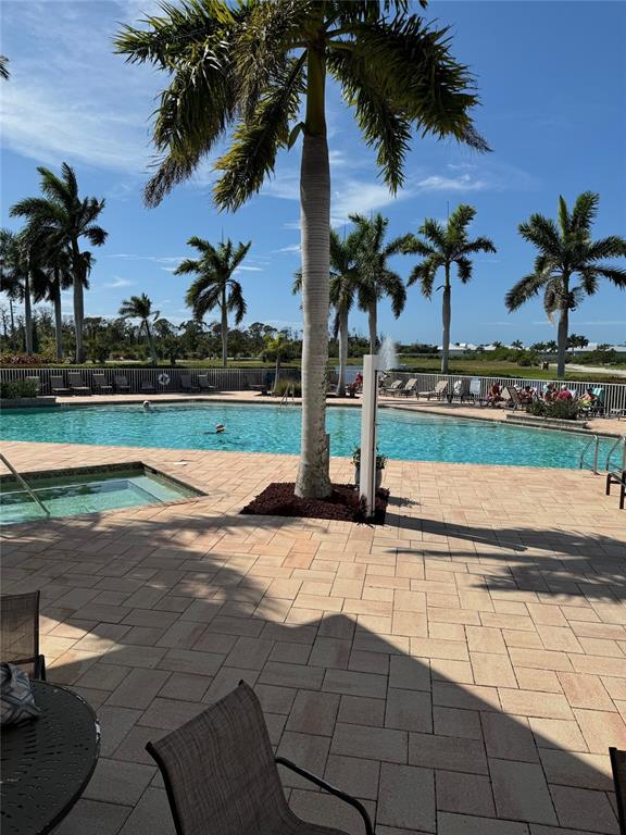 8411 Placida Road, Unit 205 Placida, FL 33946 - Photo 2 of 51 a view of a yard with palm trees