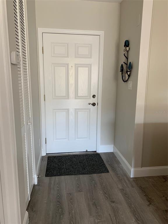 8411 Placida Road, Unit 205 Placida, FL 33946 - Photo 30 of 51 an entryway view with wooden floor
