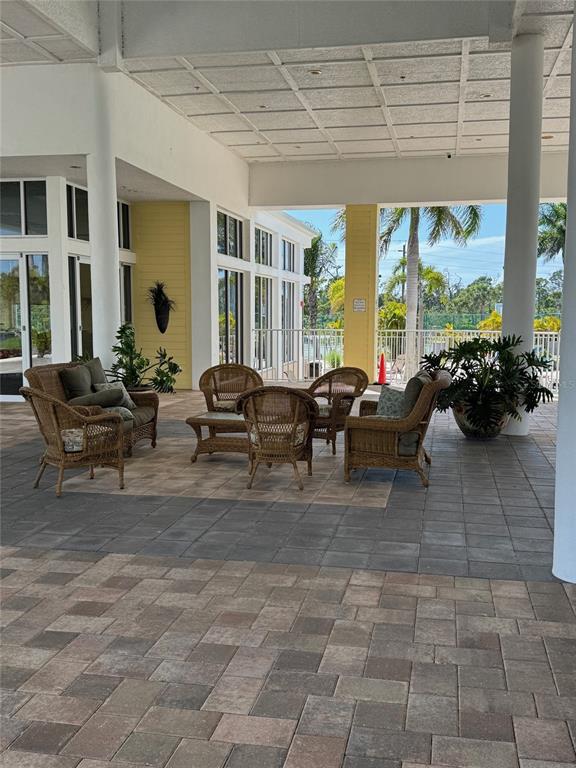 8411 Placida Road, Unit 205 Placida, FL 33946 - Photo 40 of 51 a living room with furniture and large windows
