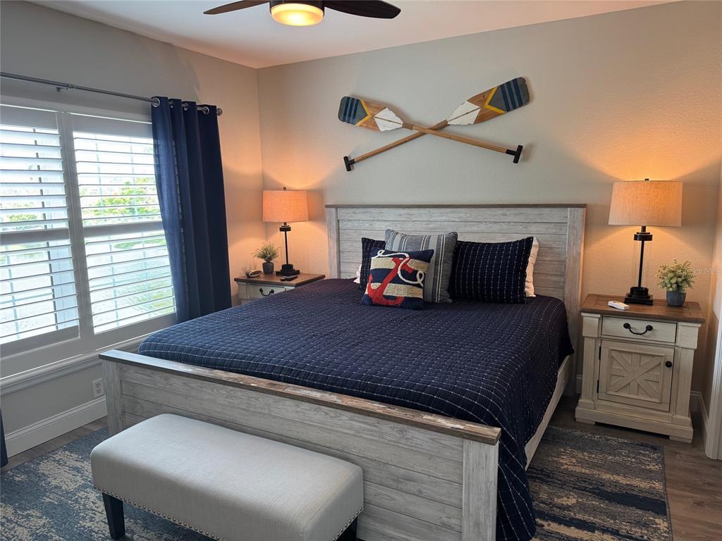 8411 Placida Road, Unit 205 Placida, FL 33946 - Photo 4 of 51 a bedroom with a bed and window