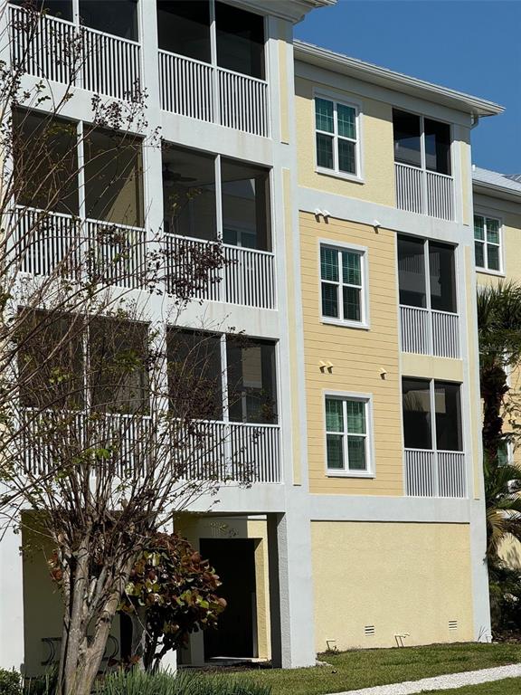 8411 Placida Road, Unit 205 Placida, FL 33946 - Photo 42 of 51 a front view of a building with glass windows