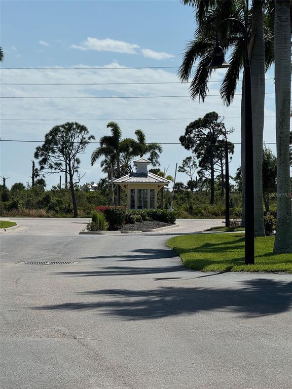 8411 Placida Road, Unit 205 Placida, FL 33946 - Photo 45 of 51 a front view of a house with a garden