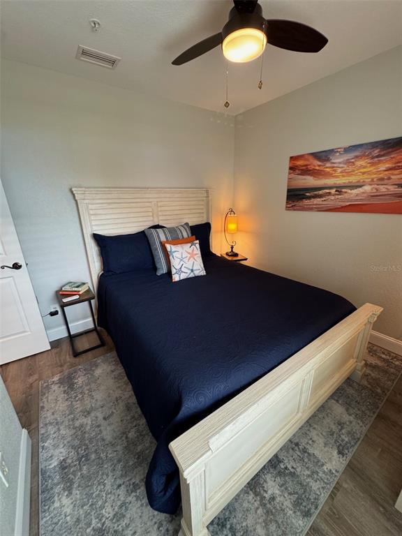 8411 Placida Road, Unit 205 Placida, FL 33946 - Photo 9 of 51 a bed sitting in a bedroom next to a larger window