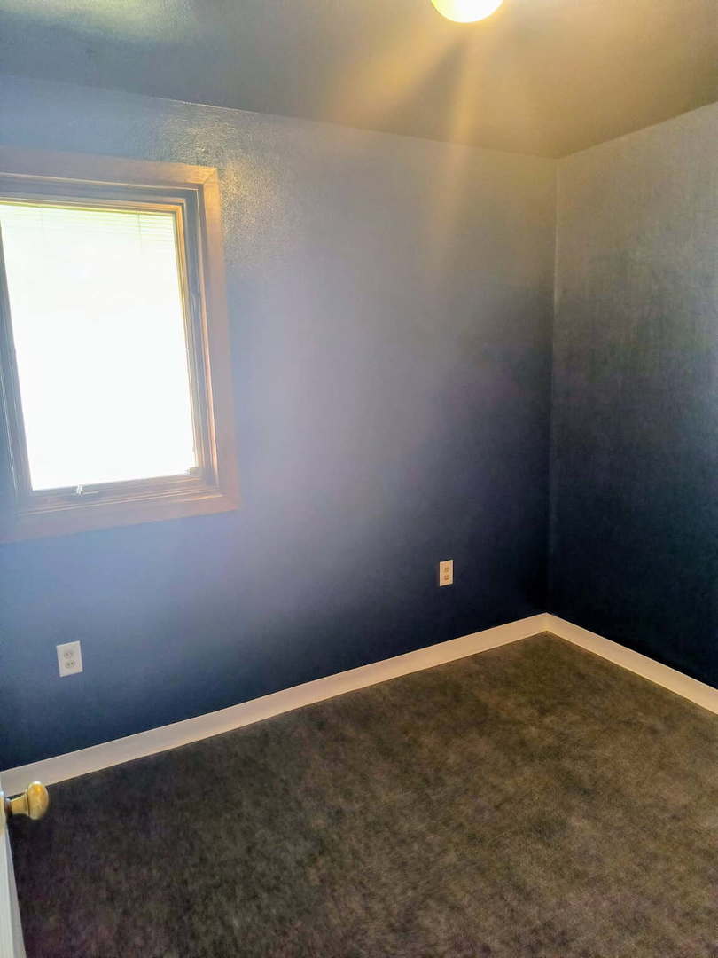 1003 41st Street Moline, IL 61265 - Photo 12 of 17 an empty room with a window