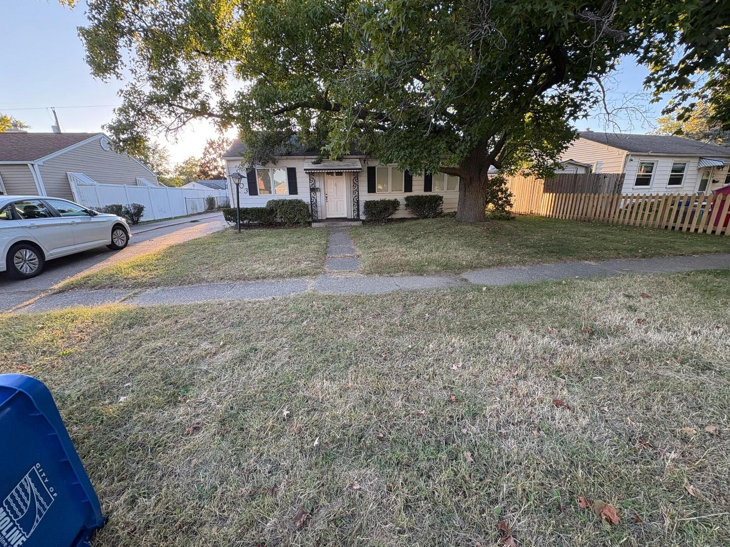 1003 41st Street Moline, IL 61265 - Photo 3 of 17 a view of a yard with a house and a tree