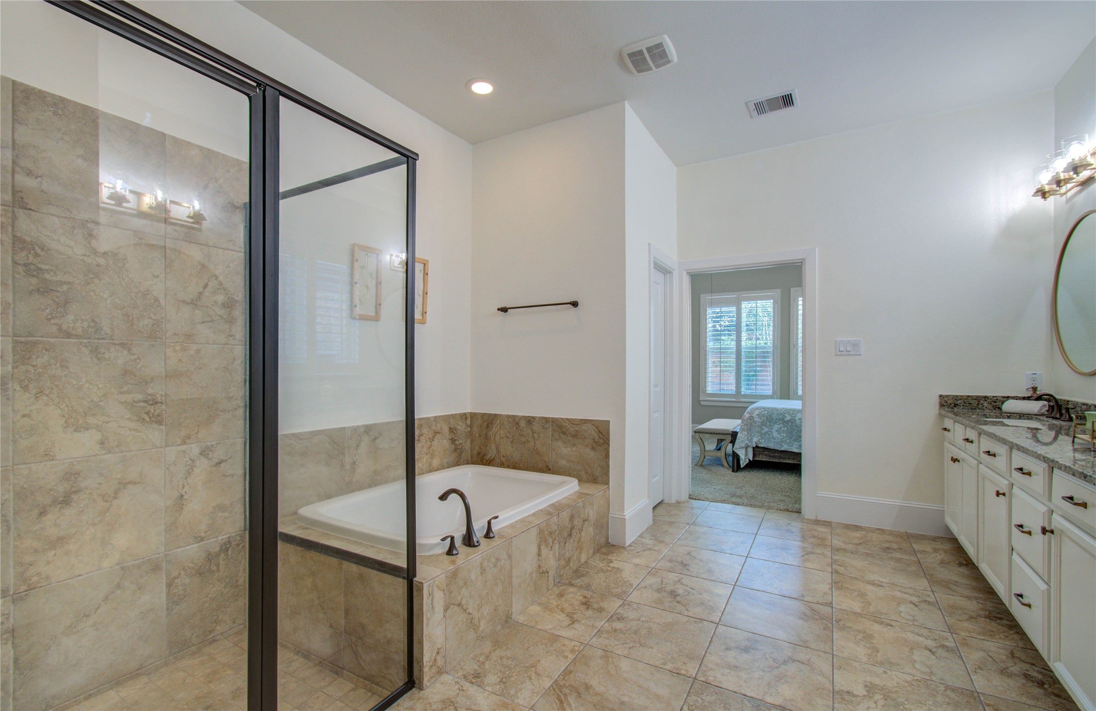 28627 Rolling Ridge Drive Katy, TX 77494 - Photo 26 of 44 a bathroom with a tub shower and mirror