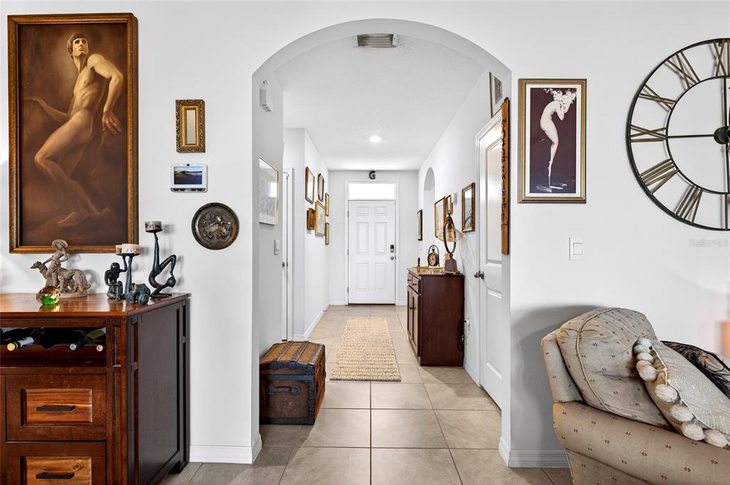 508 Hickory Course Loop Ocala, FL 34472 - Photo 11 of 40 a view of a hallway with living room and utility room