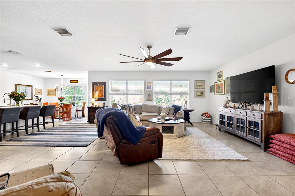508 Hickory Course Loop Ocala, FL 34472 - Photo 13 of 40 a living room with furniture and a flat screen tv