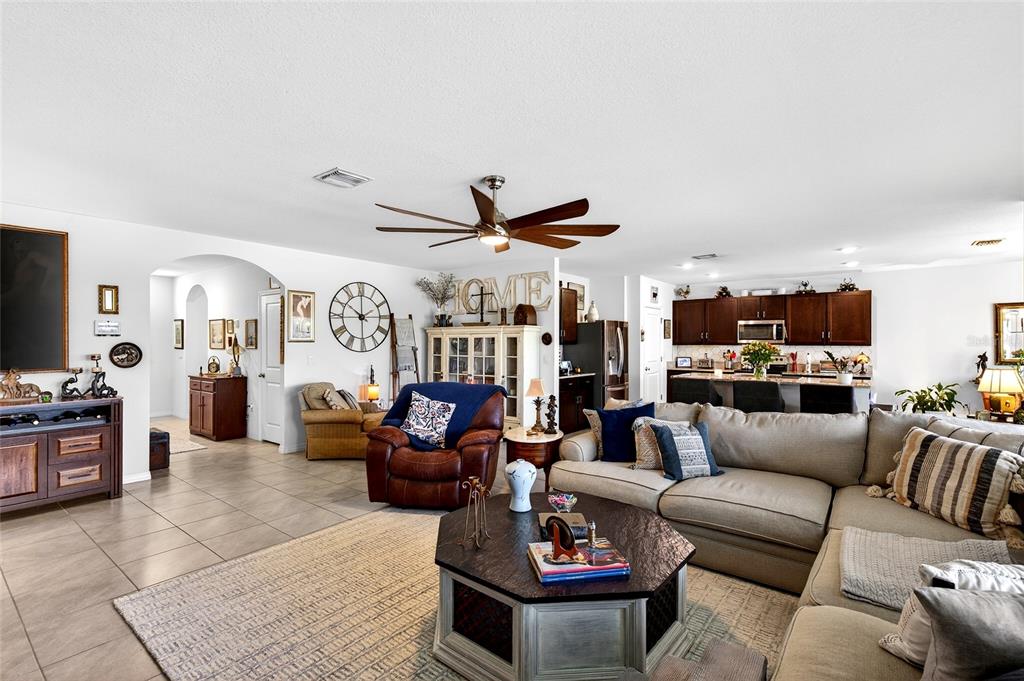 508 Hickory Course Loop Ocala, FL 34472 - Photo 14 of 40 a living room with furniture kitchen view and a large window