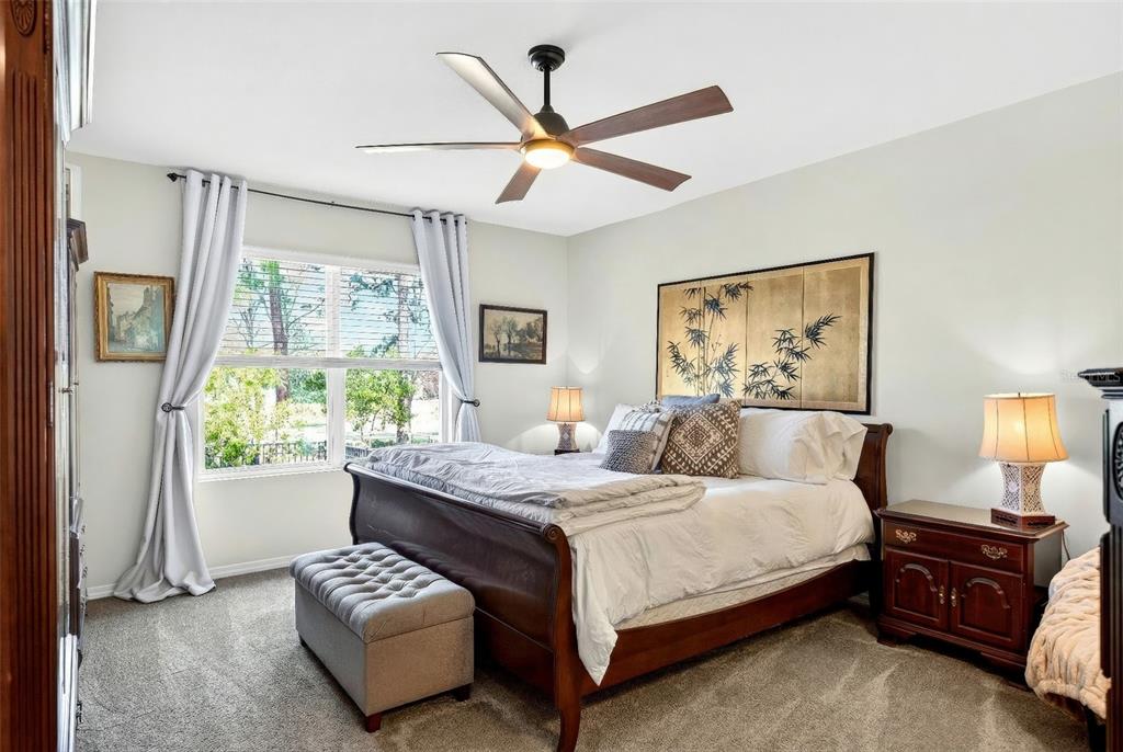 508 Hickory Course Loop Ocala, FL 34472 - Photo 16 of 40 a bedroom with a bed and a large window