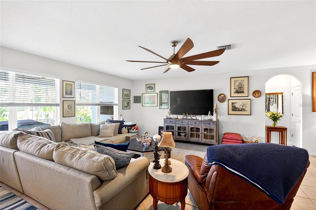 508 Hickory Course Loop Ocala, FL 34472 - Photo 22 of 40 a living room with furniture a flat screen tv and a large window