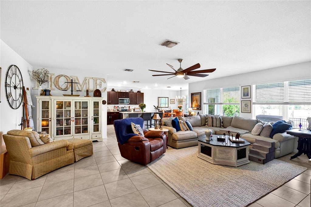 508 Hickory Course Loop Ocala, FL 34472 - Photo 25 of 40 a living room with furniture kitchen view and a large window