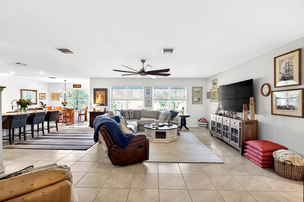 508 Hickory Course Loop Ocala, FL 34472 - Photo 26 of 40 a living room with furniture and a flat screen tv