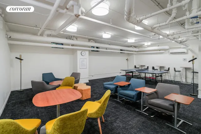 a bedroom with a workspace