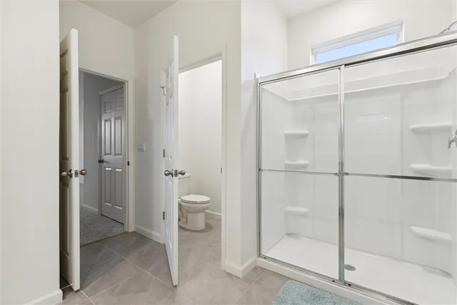 a bathroom with a shower and a sink