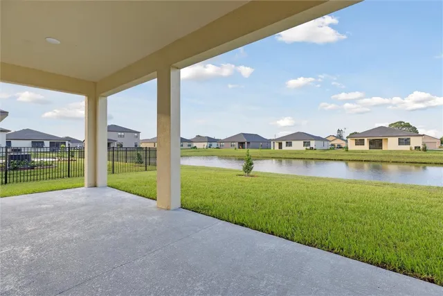 a view of swimming pool and a yard