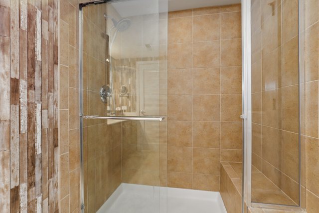 225 Main Street, Unit 214 Roselle, IL 60172 - Photo 16 of 27 a bathroom with a shower