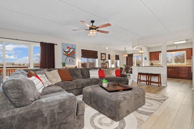 225 Main Street, Unit 214 Roselle, IL 60172 - Photo 2 of 27 a living room with furniture and a large window